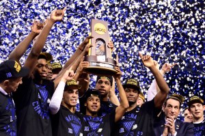 Apr 6, 2015; Indianapolis, IN, USA; Duke Blue Devils guard Quinn Cook (middle) and teammates hoist the NCAA championship trophy after defeating the Wisconsin Badgers in the 2015 NCAA Men's Division I Championship game at Lucas Oil Stadium. Mandatory Credit: Bob Donnan-USA TODAY Sports